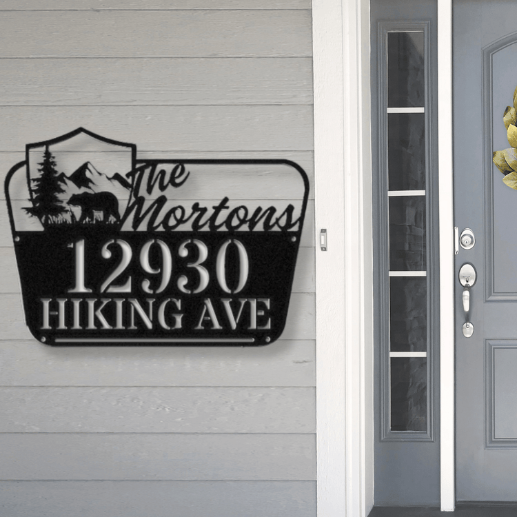 Unique Personalized Gifts For Housewarming - a National Park sign Inspired address sign hanging at a front door