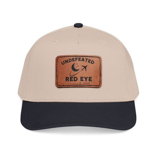 Beige and navy cap with a bear patch featuring the Polo Ralph Lauren logo on a white background