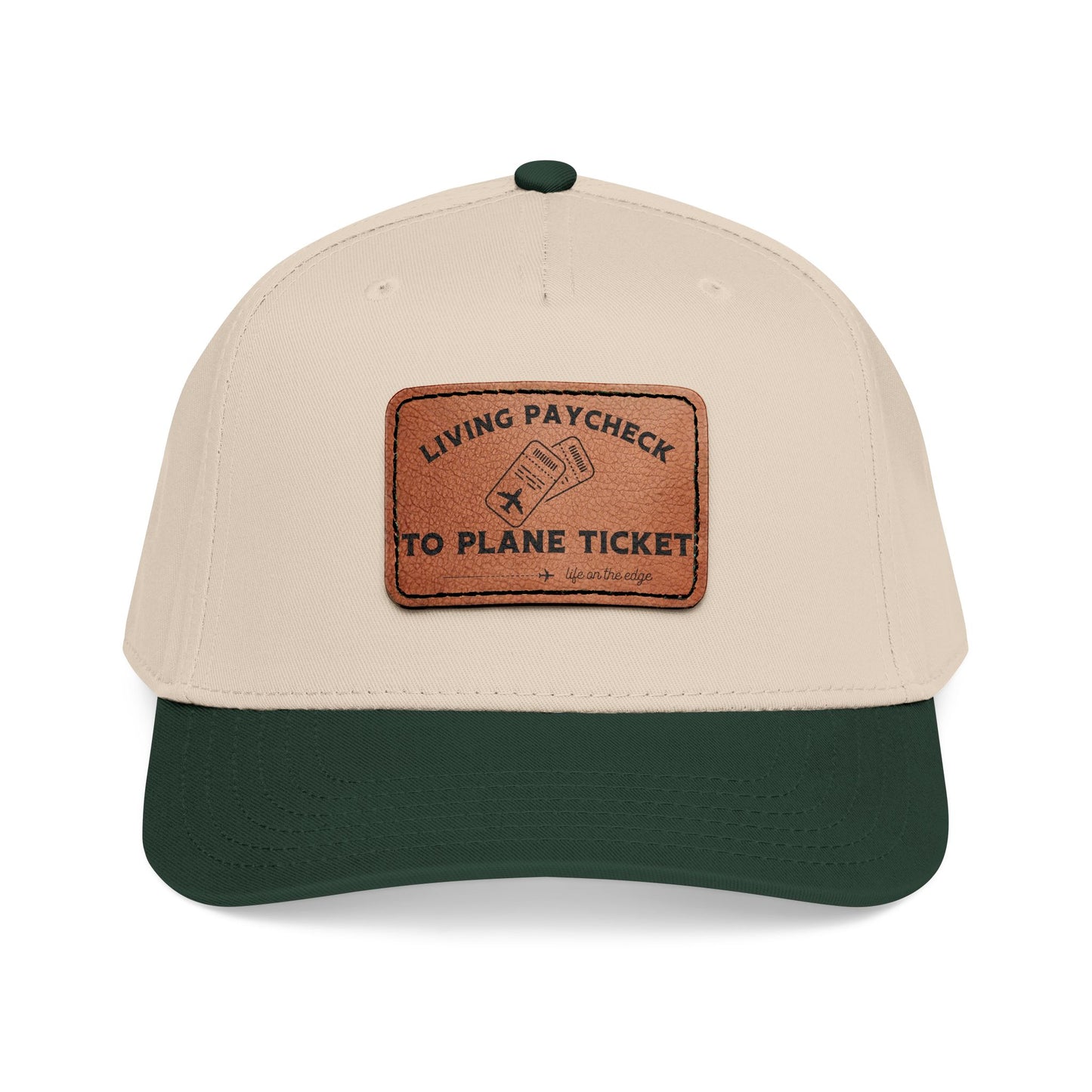 Beige and green cap with a brown leather patch displaying ''Living Paycheck to Plane Ticket"