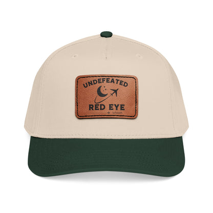 Beige and green cap with a brown patch featuring 'Undefeated Red Eye Survivor"