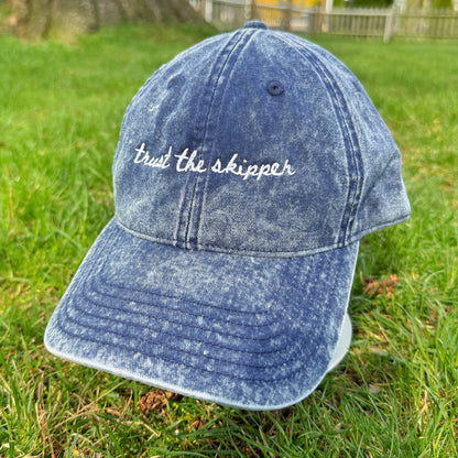 "Trust the Skipper" Funny Travel Hat for Theme park lovers- turned on grass