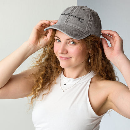 "Thanking the Phoenicians Daily" Funny Travel Hat for Theme Park Lovers- mockup on woman